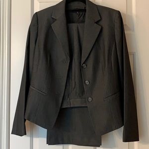 Black business pant suit with fine white line.